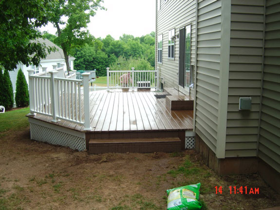 Composite Deck built onto a Colonial Home - Simply Additions