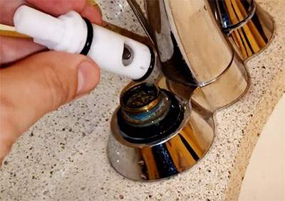Taking leaky faucet apart