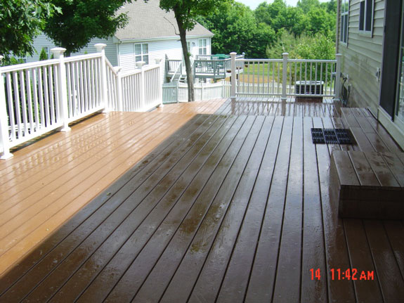 White vinyl railings and brown composite deck
