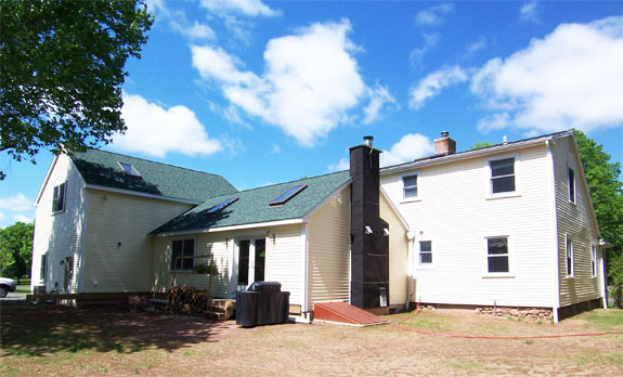 Rear view of home addition; customer is wrapping the chimney himself